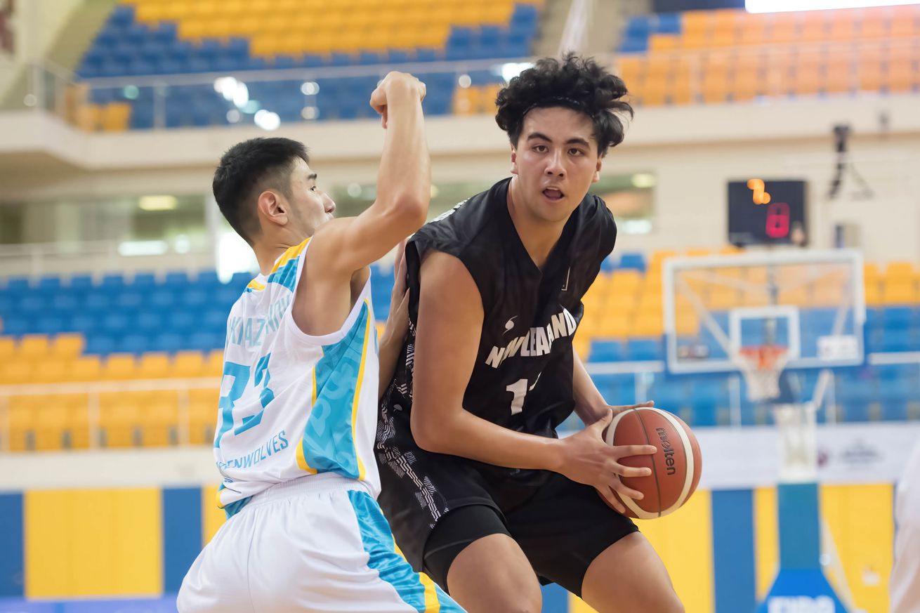 Akhan Mukhazhanov (L) of Kazakhstan Basketball team and...