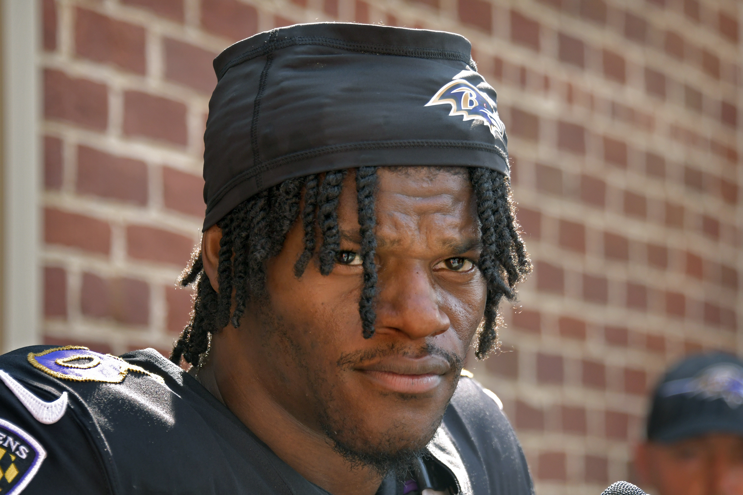 Quarterback Lamar Jackson talks to the media after practice at...