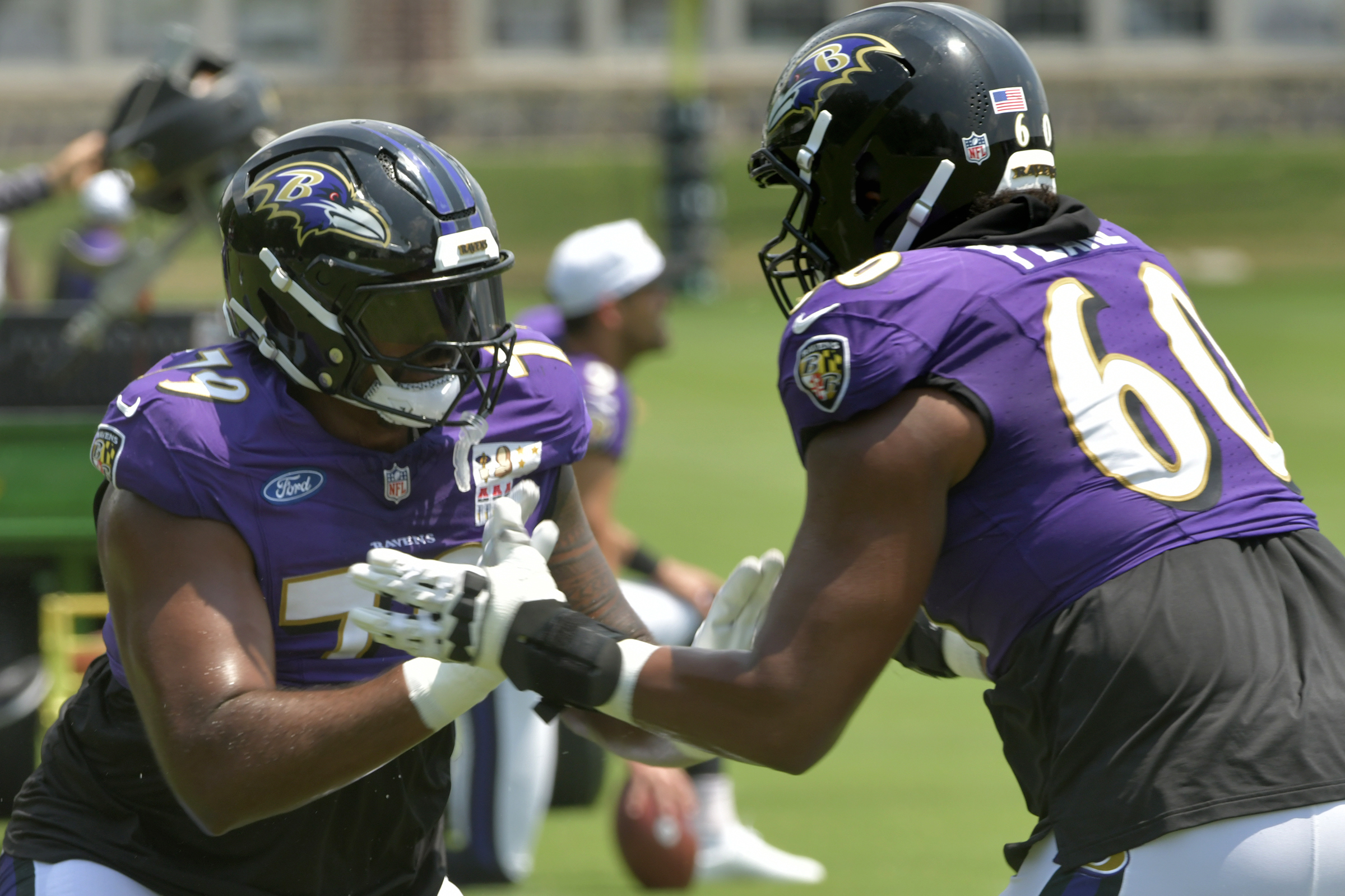 Ravens tackles Ronnie Stanley, left, and Julian Pearl work on...