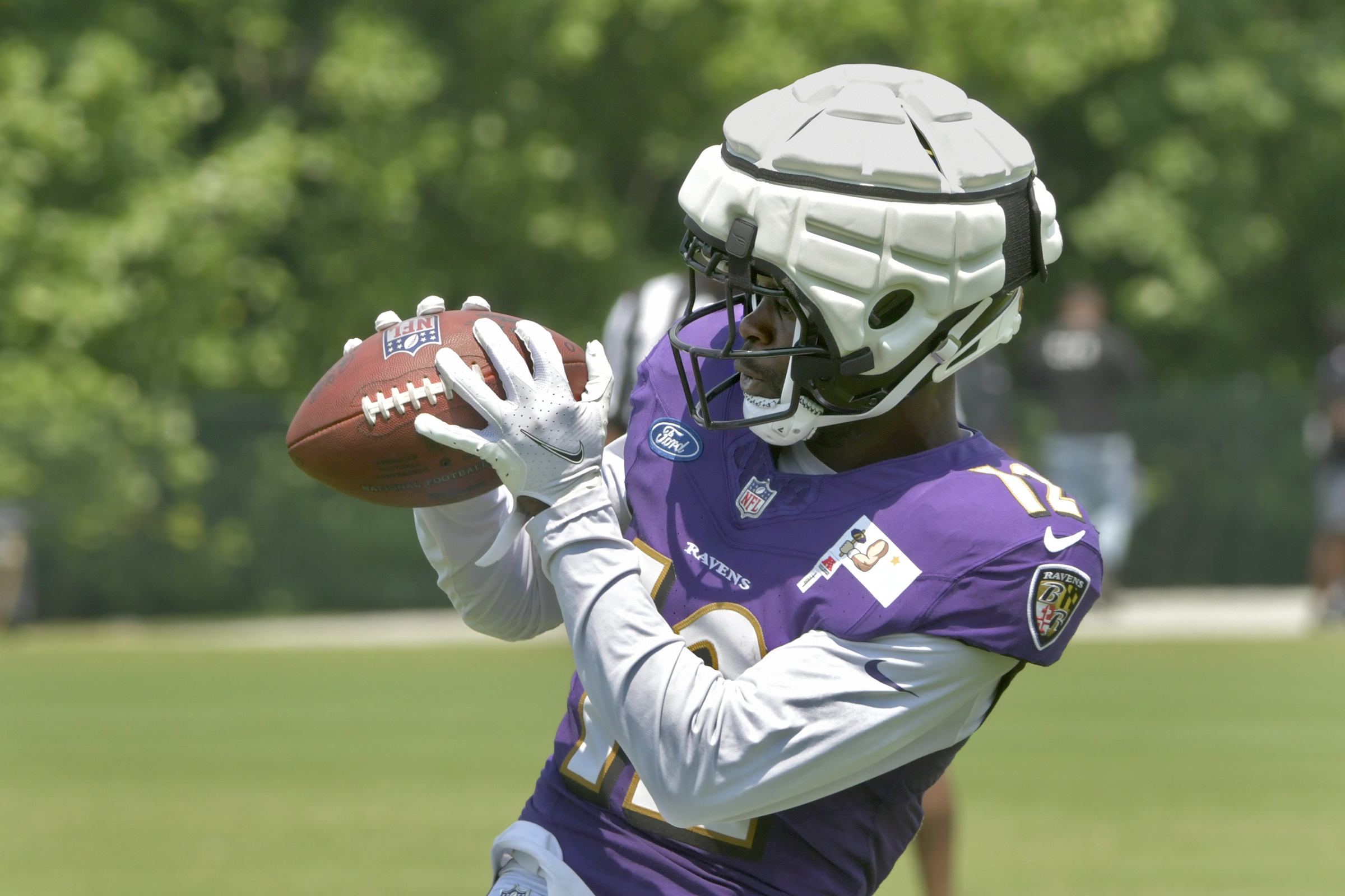 Wide receiver Malik Cunningham #12 makes a catch during practice...