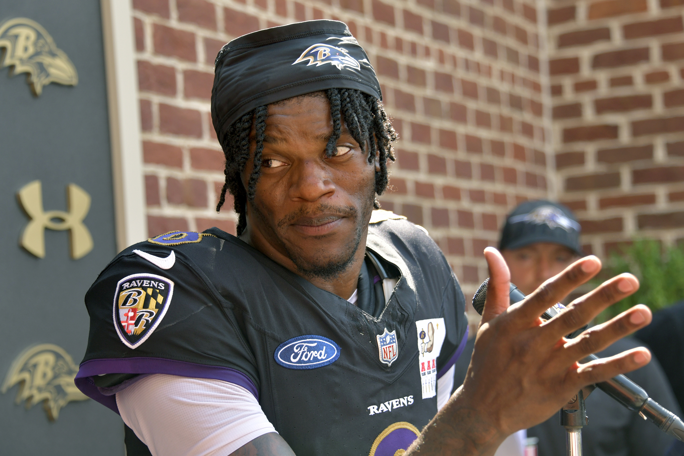 Quarterback Lamar Jackson talks to the media after practice at...