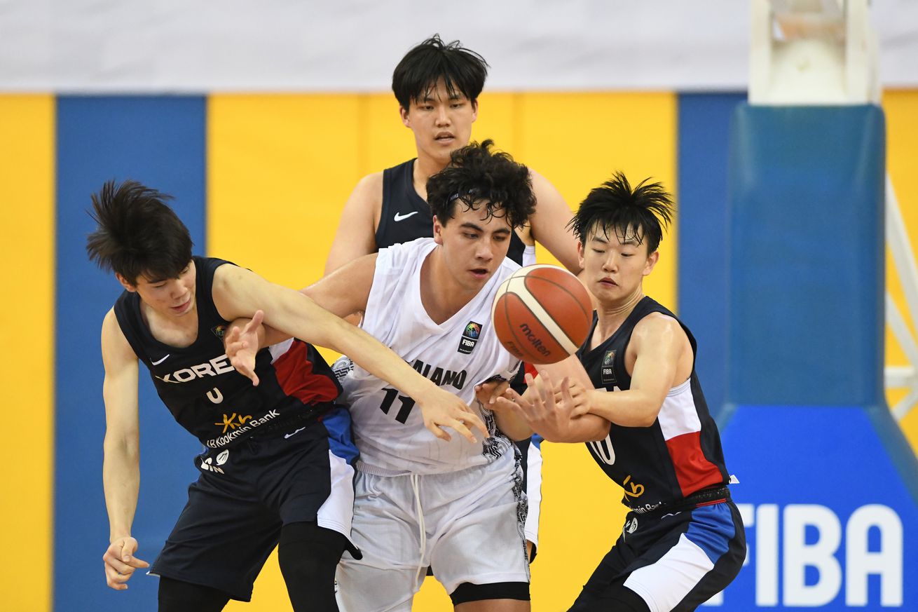 Julius Halaifonua (M) of New Zealand Basketball team and...