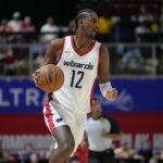 Washington Wizards top pick Alex Sarr (12) dribbles the ball