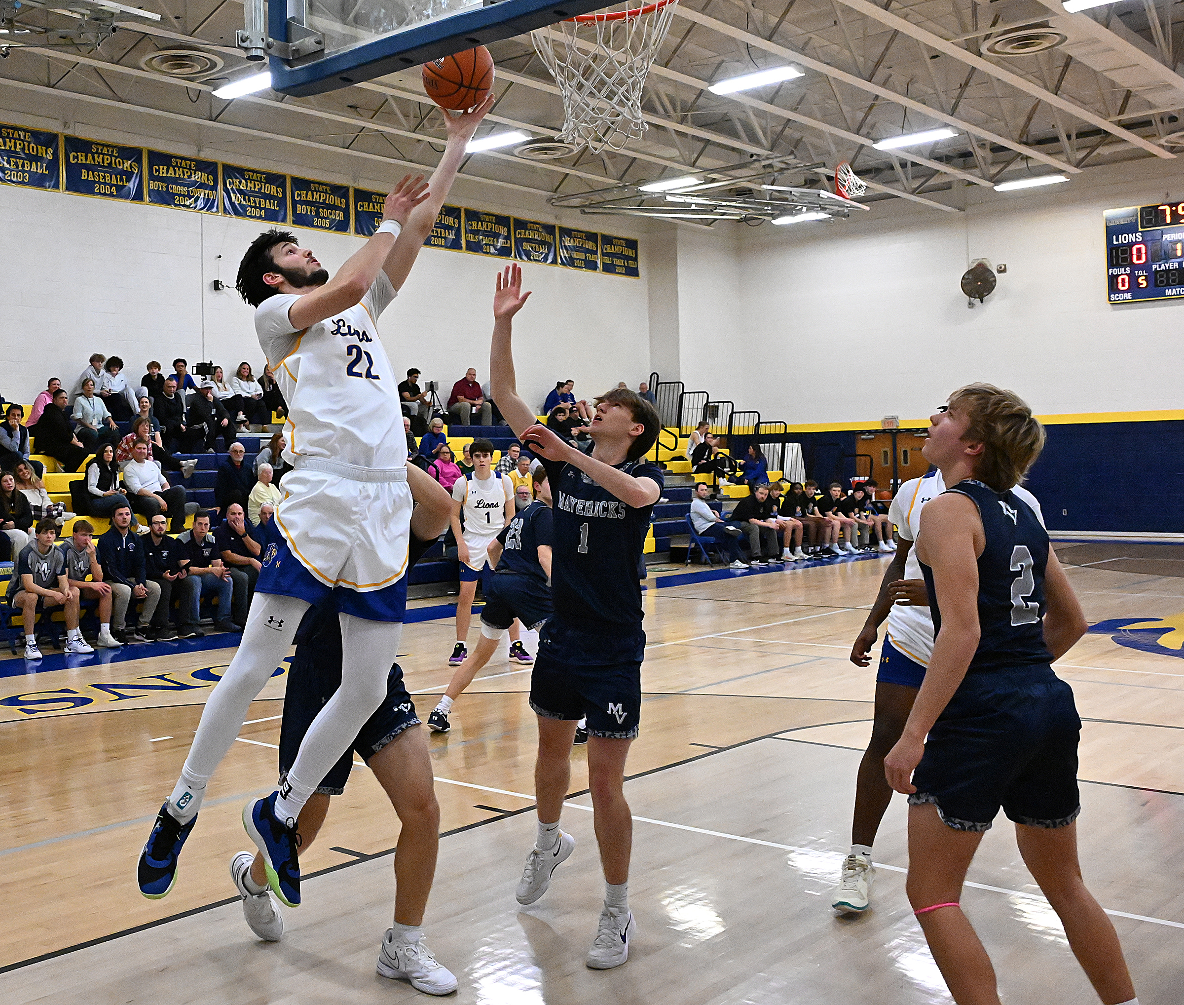 Liberty's Ethan Hart converts a layup in the first half...