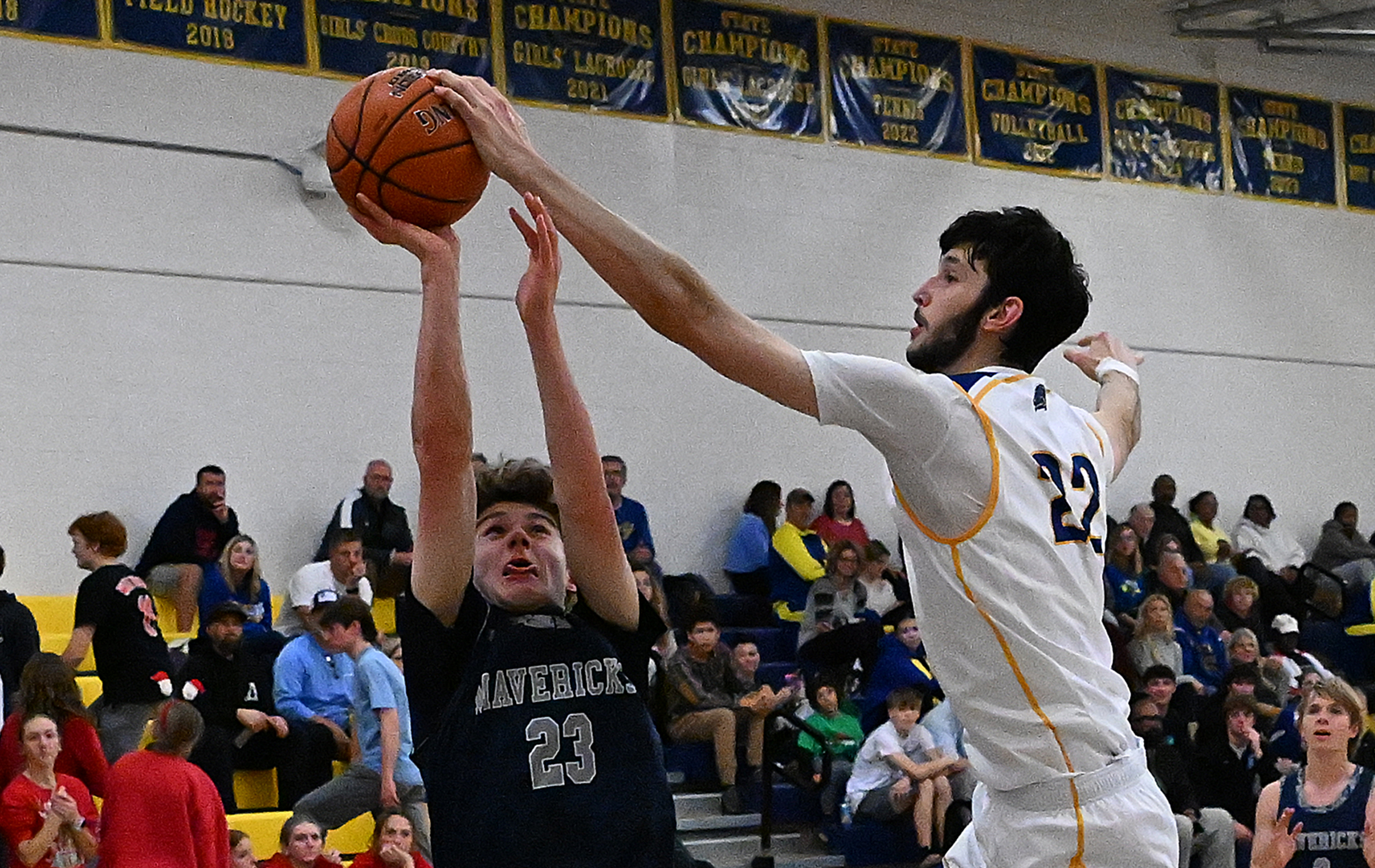 Liberty #22, Ethan Hart blocks layup from Manchester Valley #23,...