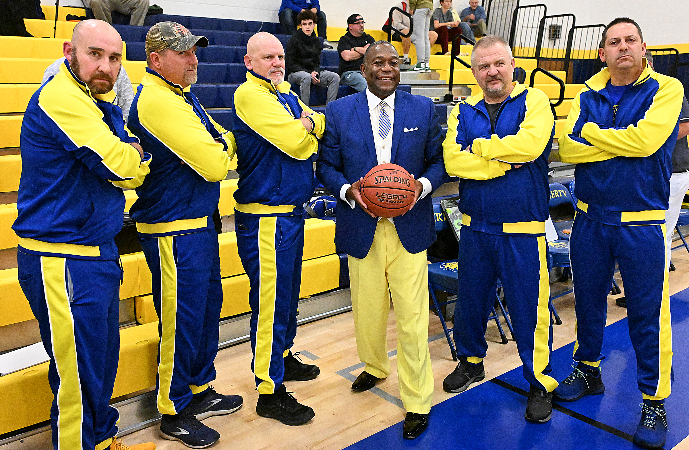 Liberty's senior girls basketball players' dads, dress alike and pose...