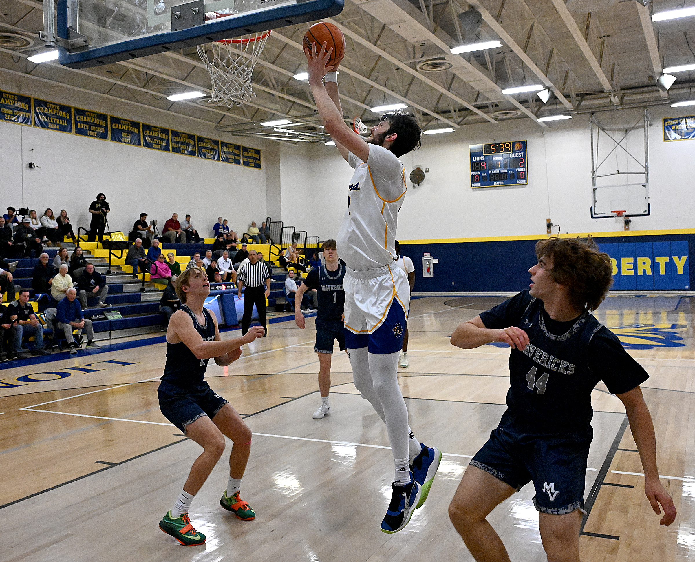 Liberty #22, Ethan Hart shoots two in the paint in...