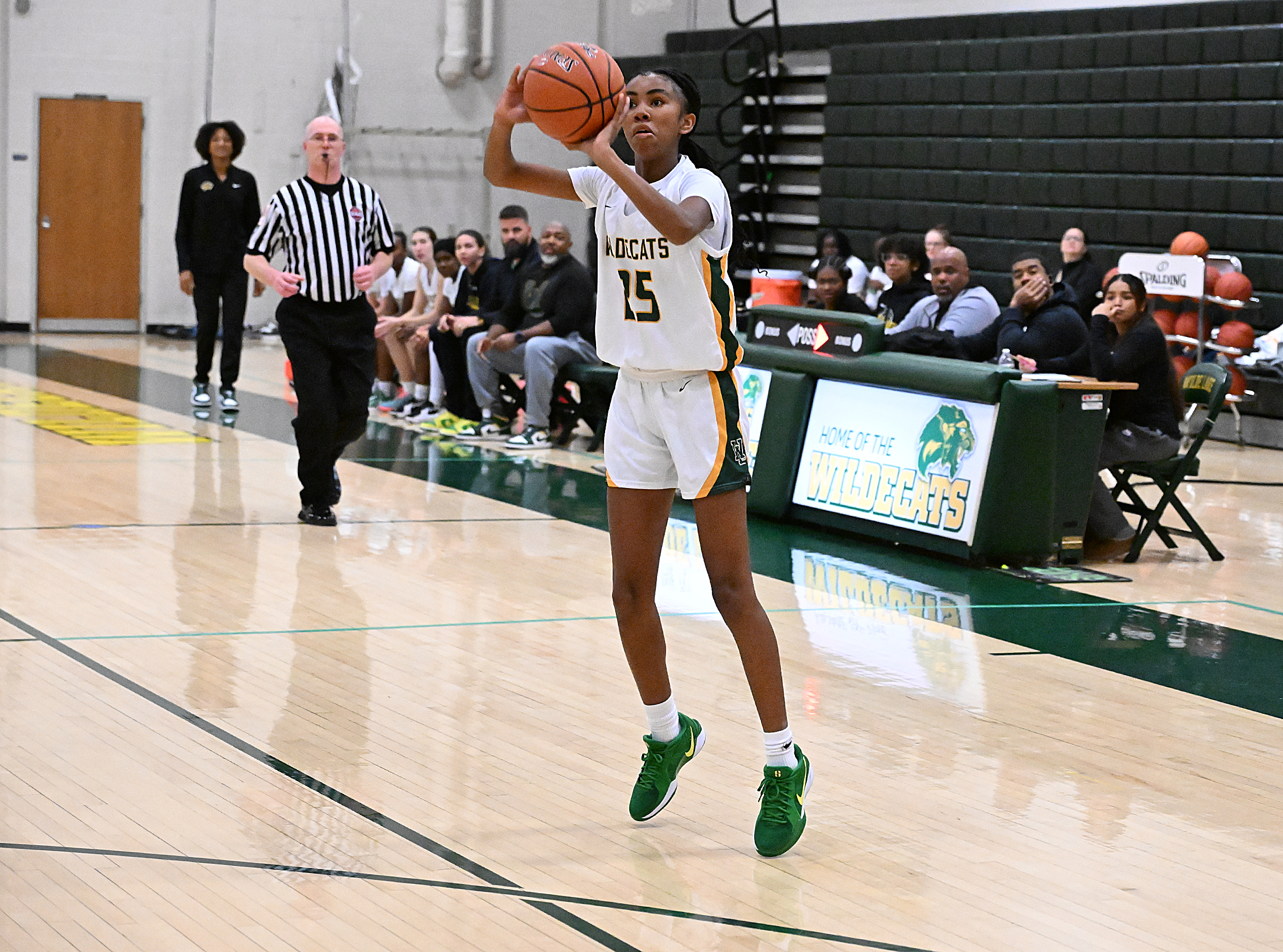 Wilde Lake's Trinity Chappell, sinks a 3-pointer in the first...