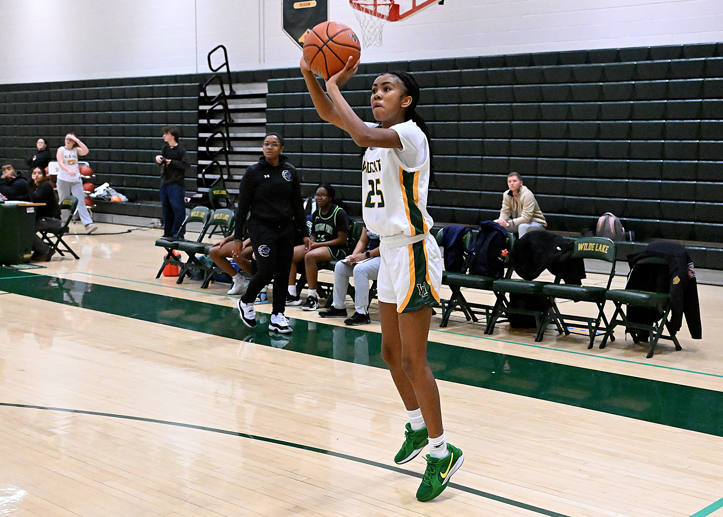 Wilde Lake #25, Trinity Chappell, sinks a two in the...