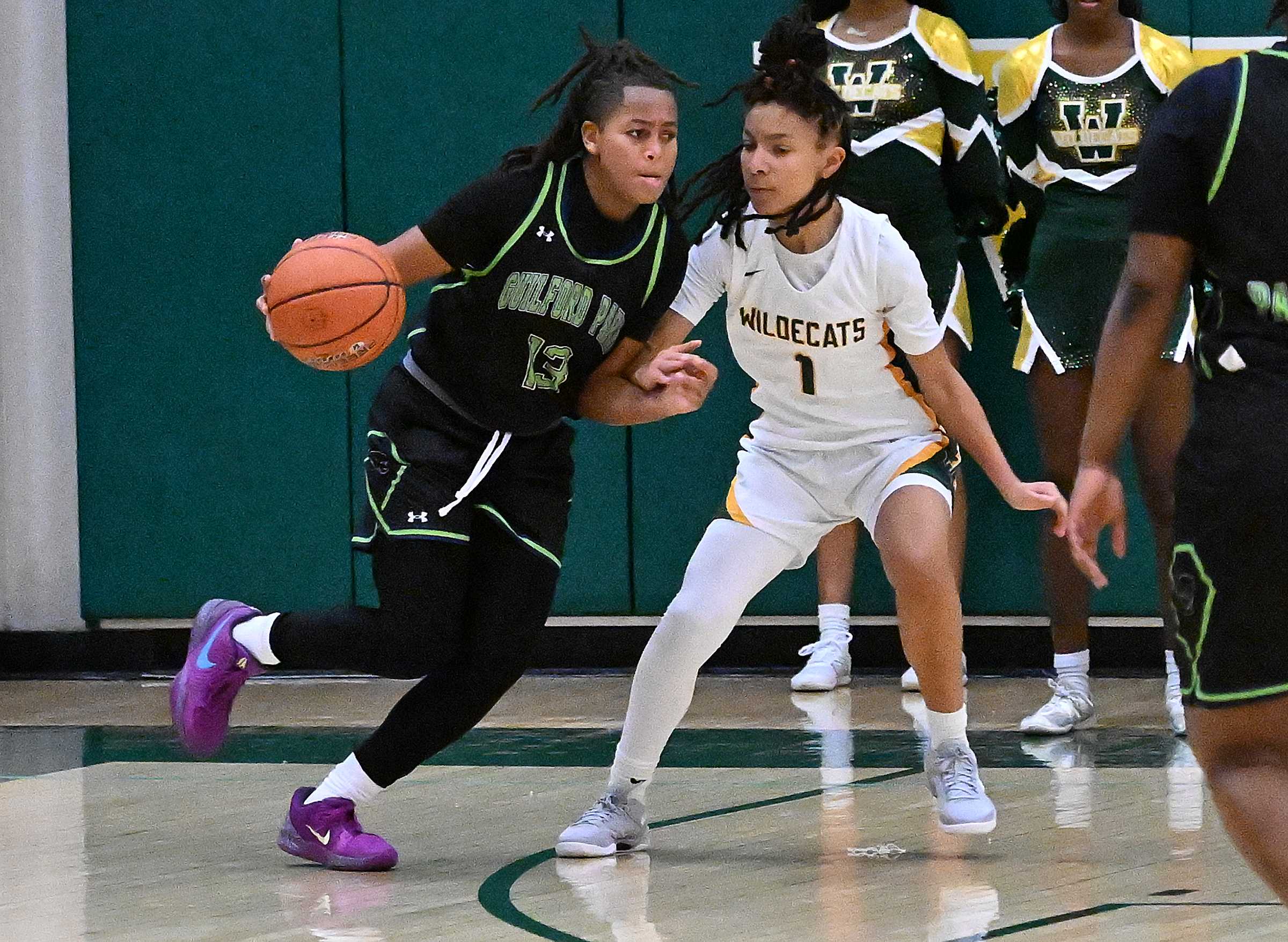 Guilford Park #13, Londyn Wiseman, drives toward the basket in...