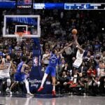 Minnesota Timberwolves guard Anthony Edwards (5) makes a basket against the Dallas Mavericks