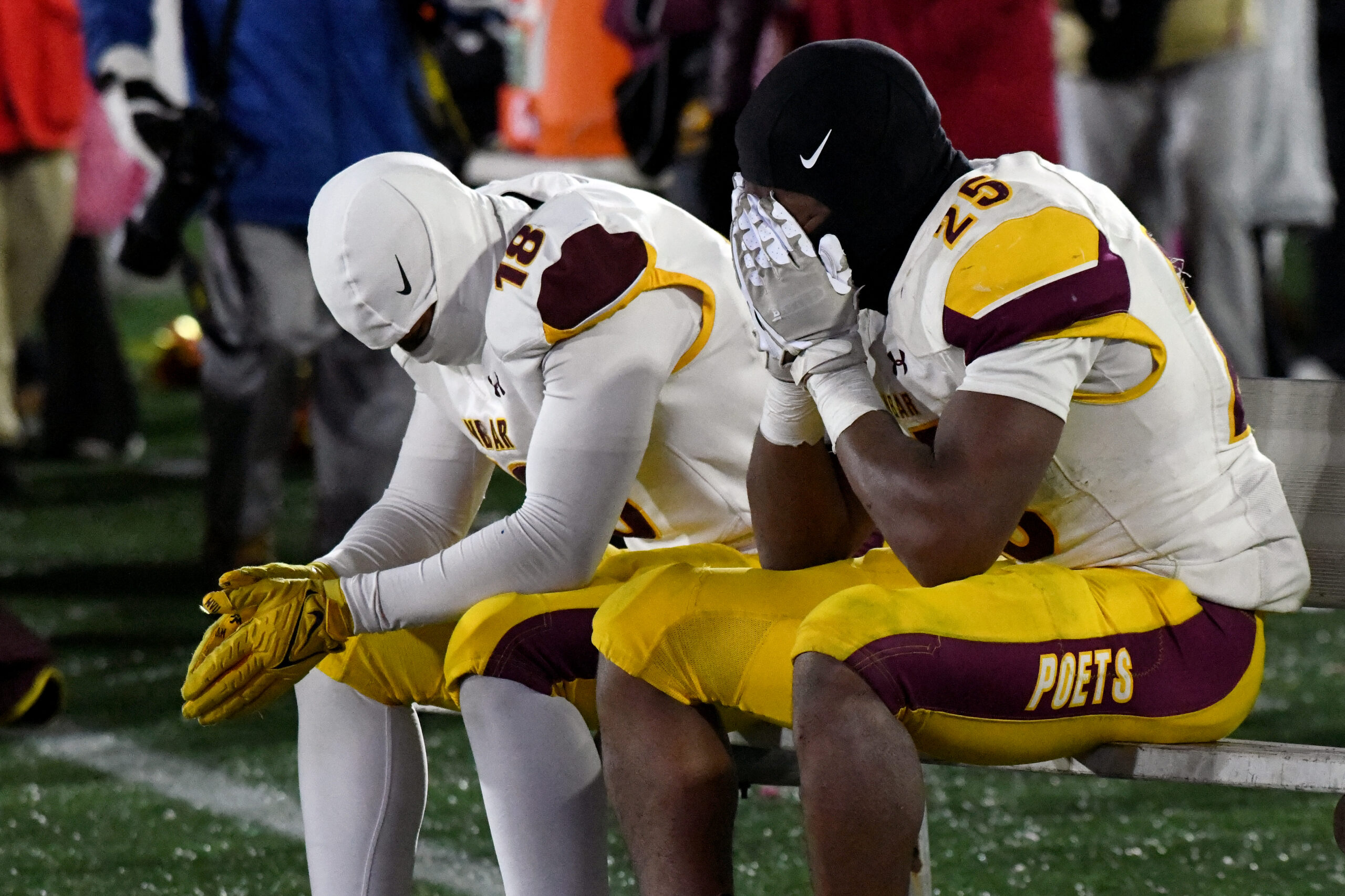 From left, Normauri Johnson and Cordae James, Dunbar, react to...