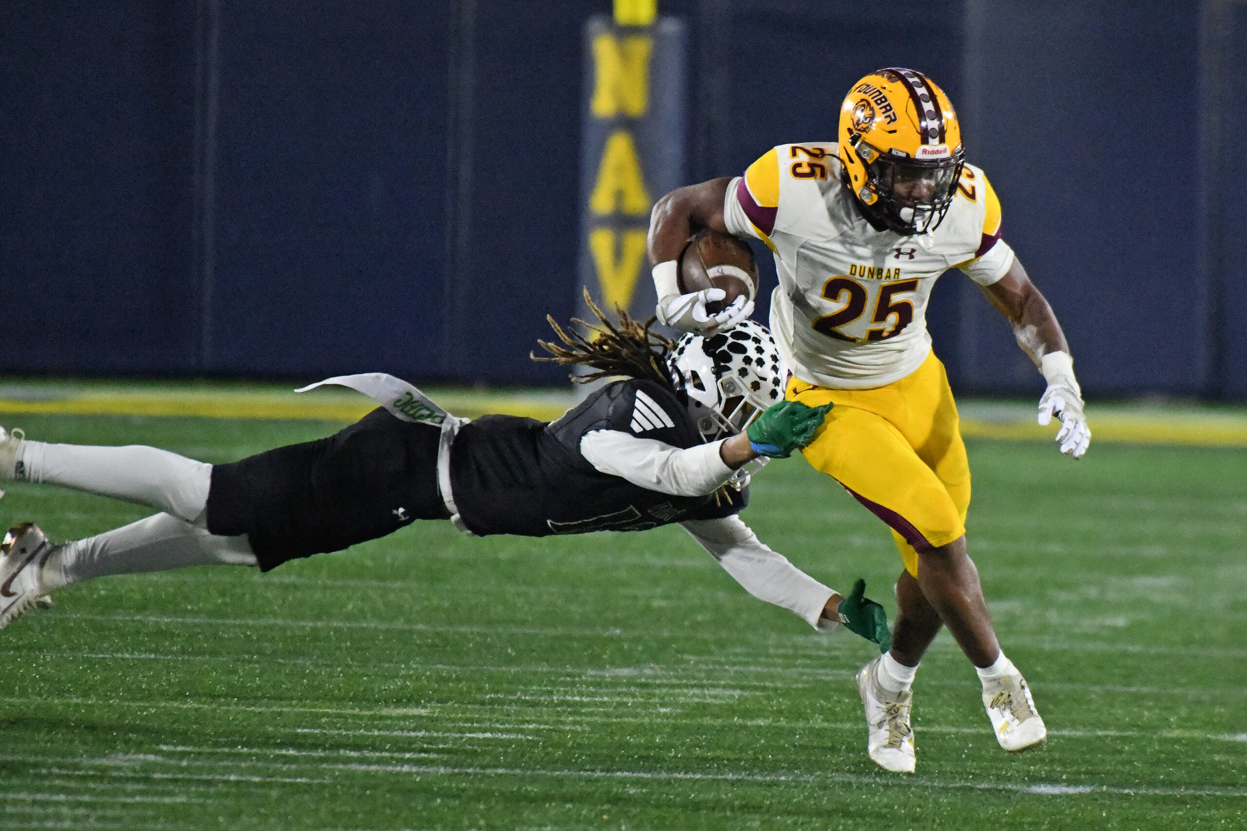 Cordae James, Dunbar, steps around Kiante Johnson, Patuxent, in the...