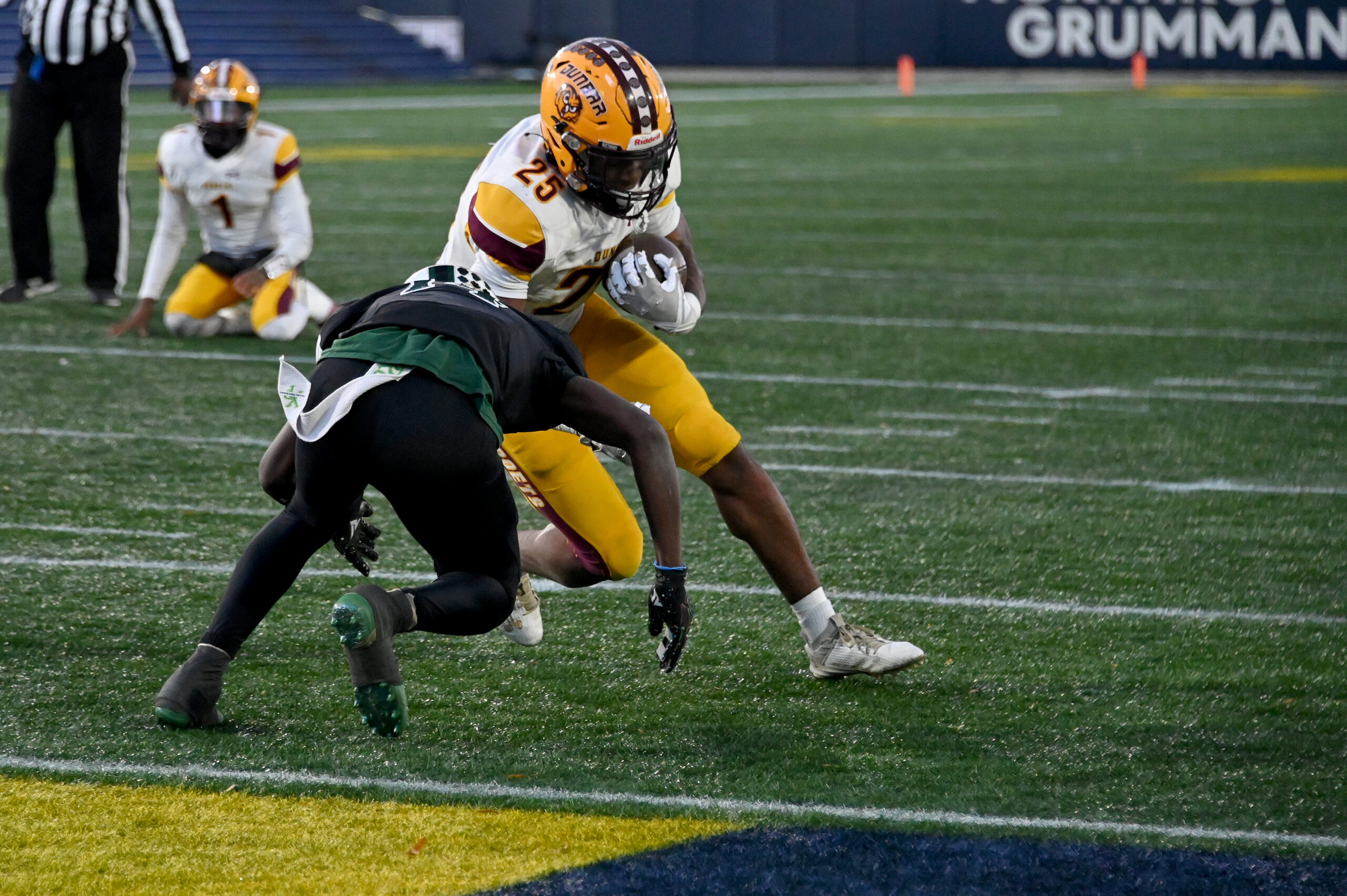 Cordae James, Dunbar, is stopped on 4th down by Jordan...