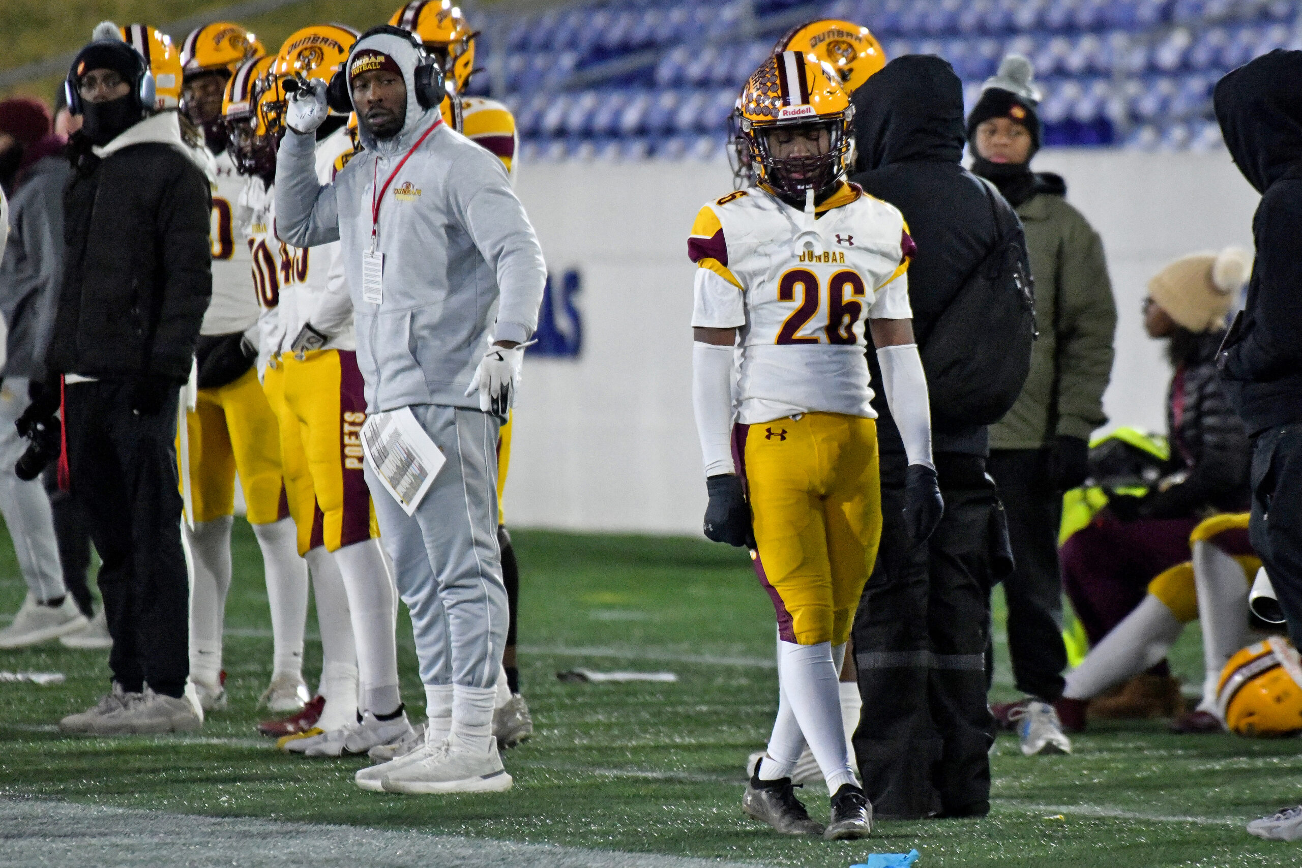 Jason Gause, Dunbar, walks the sideline after being ejected for...