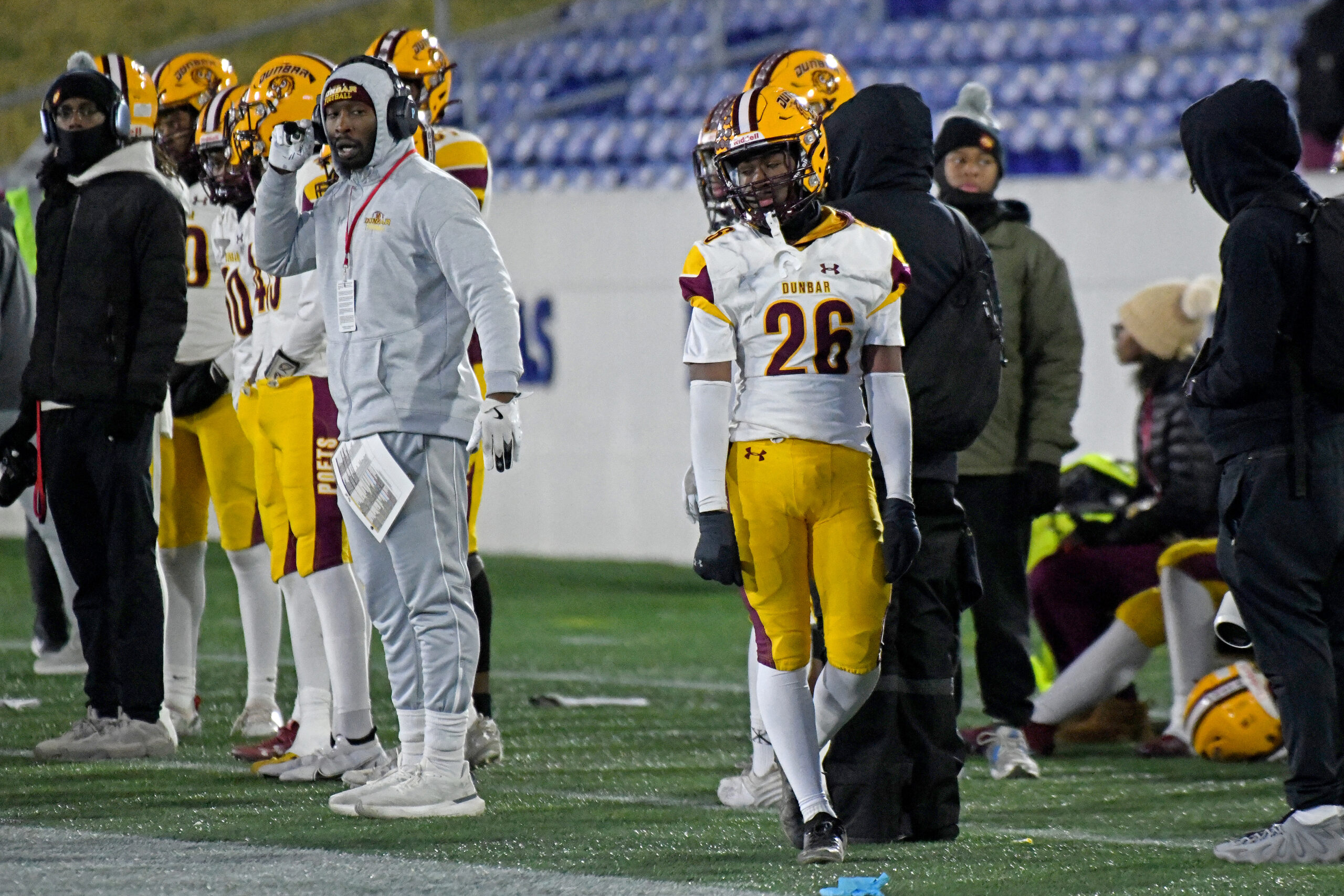 Jason Gause, Dunbar, walks the sideline after being ejected for...