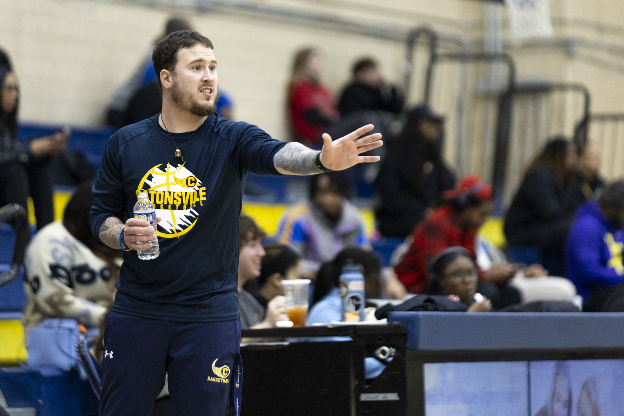 Catonsville Head Coach Jason Harris advises his team during the...