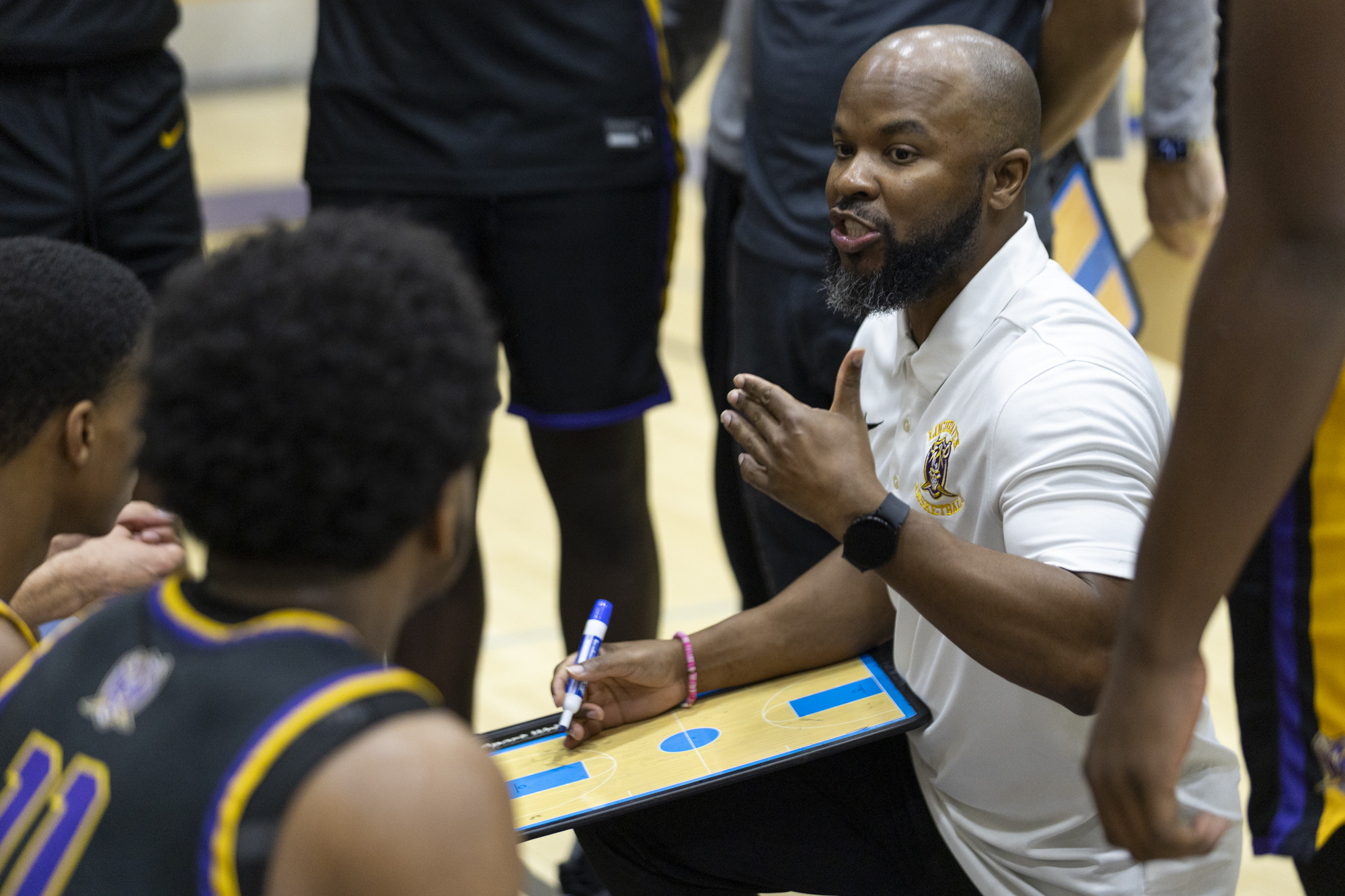 Loch Raven Head Coach Brandon Thomas gives the Raiders adjustments...