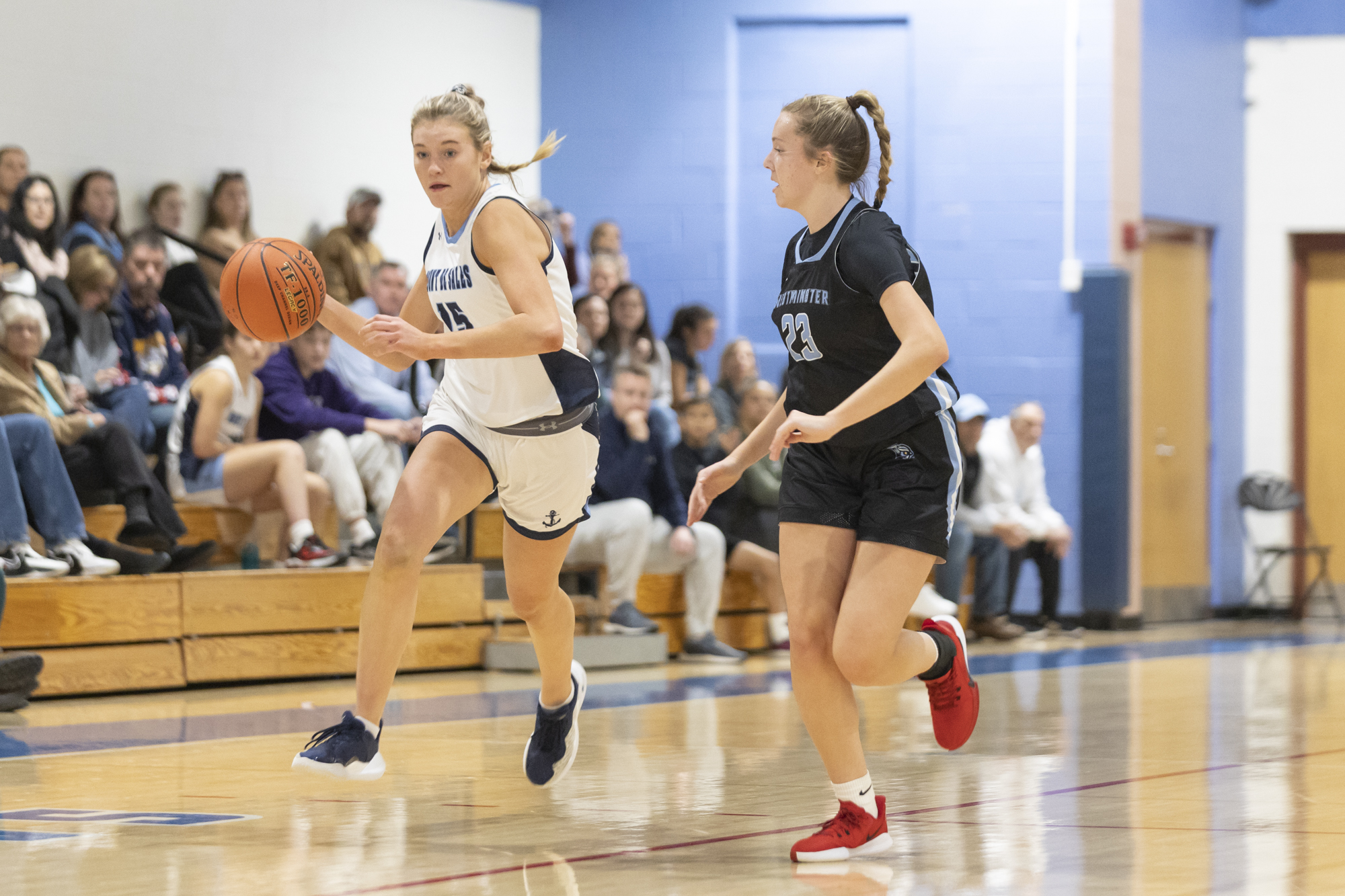 Katie Carroll drives down court against Brinley Boag during the...