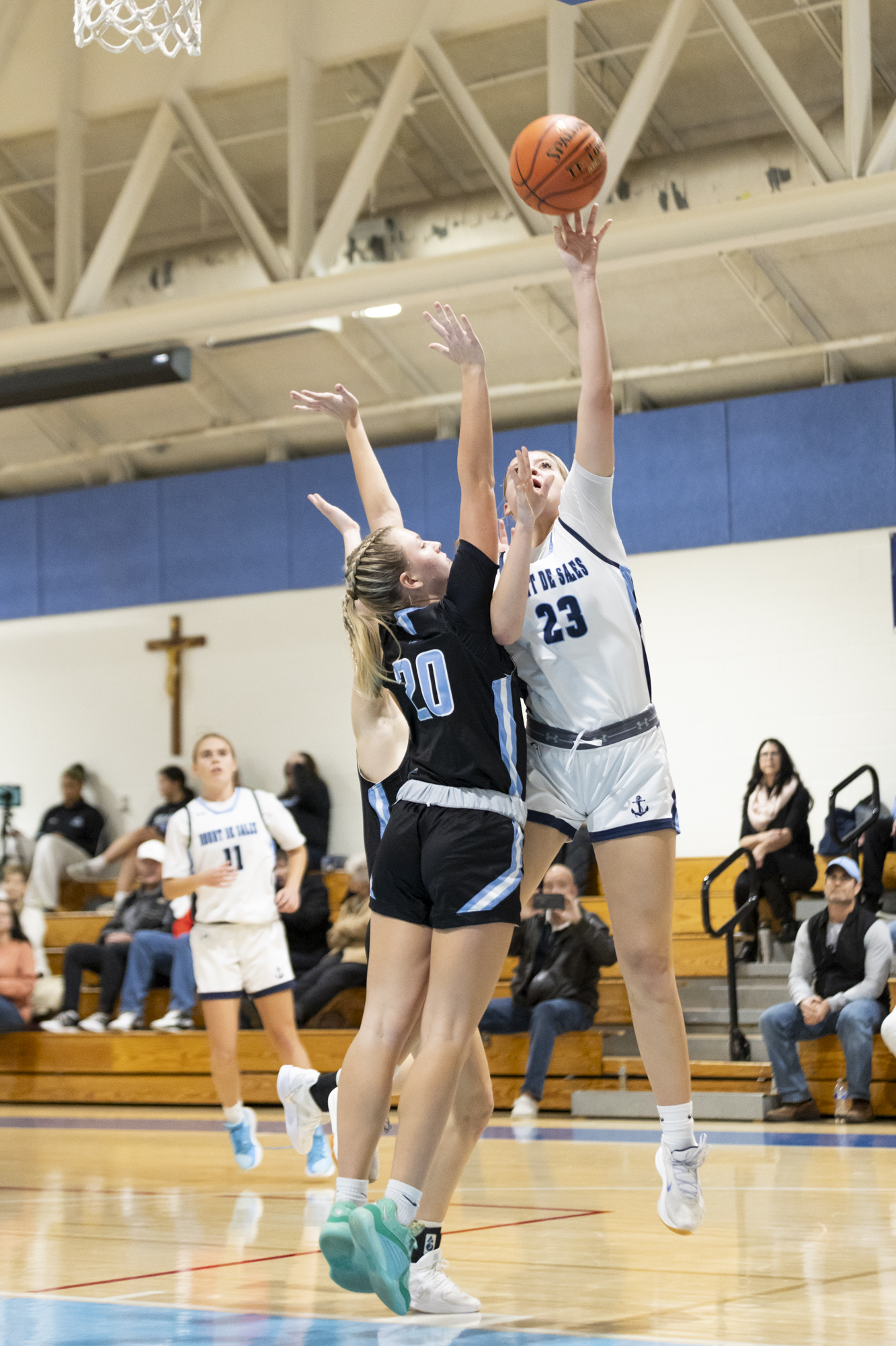 Shelby Lewis puts up a shot over Aspen Higgs during...