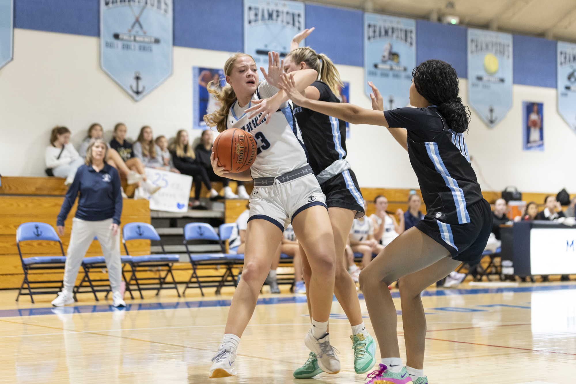 Shelby Lewis feels the pressure of a tough Westminster defense...