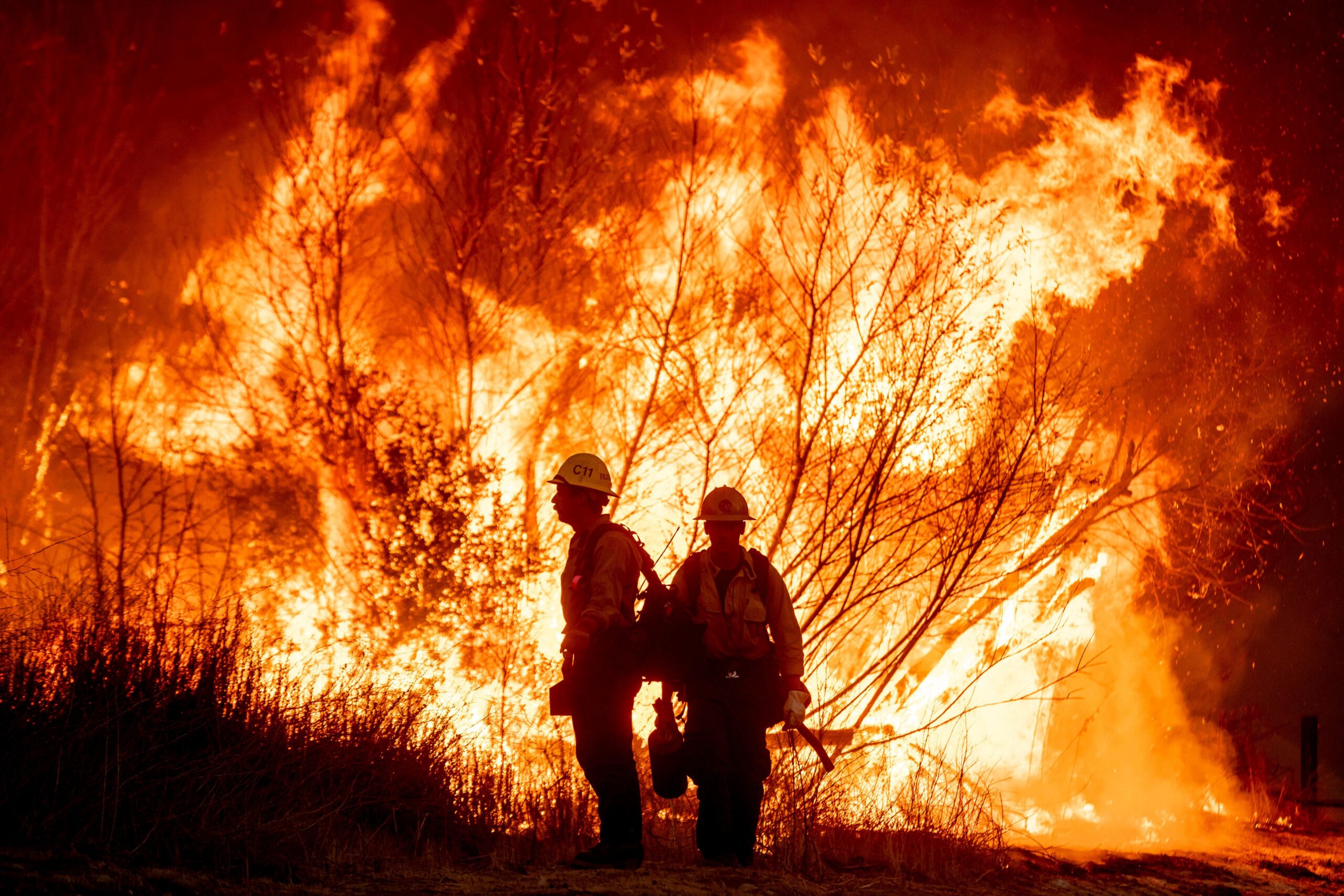 Fire crews battle the Kenneth Fire in the West Hills...