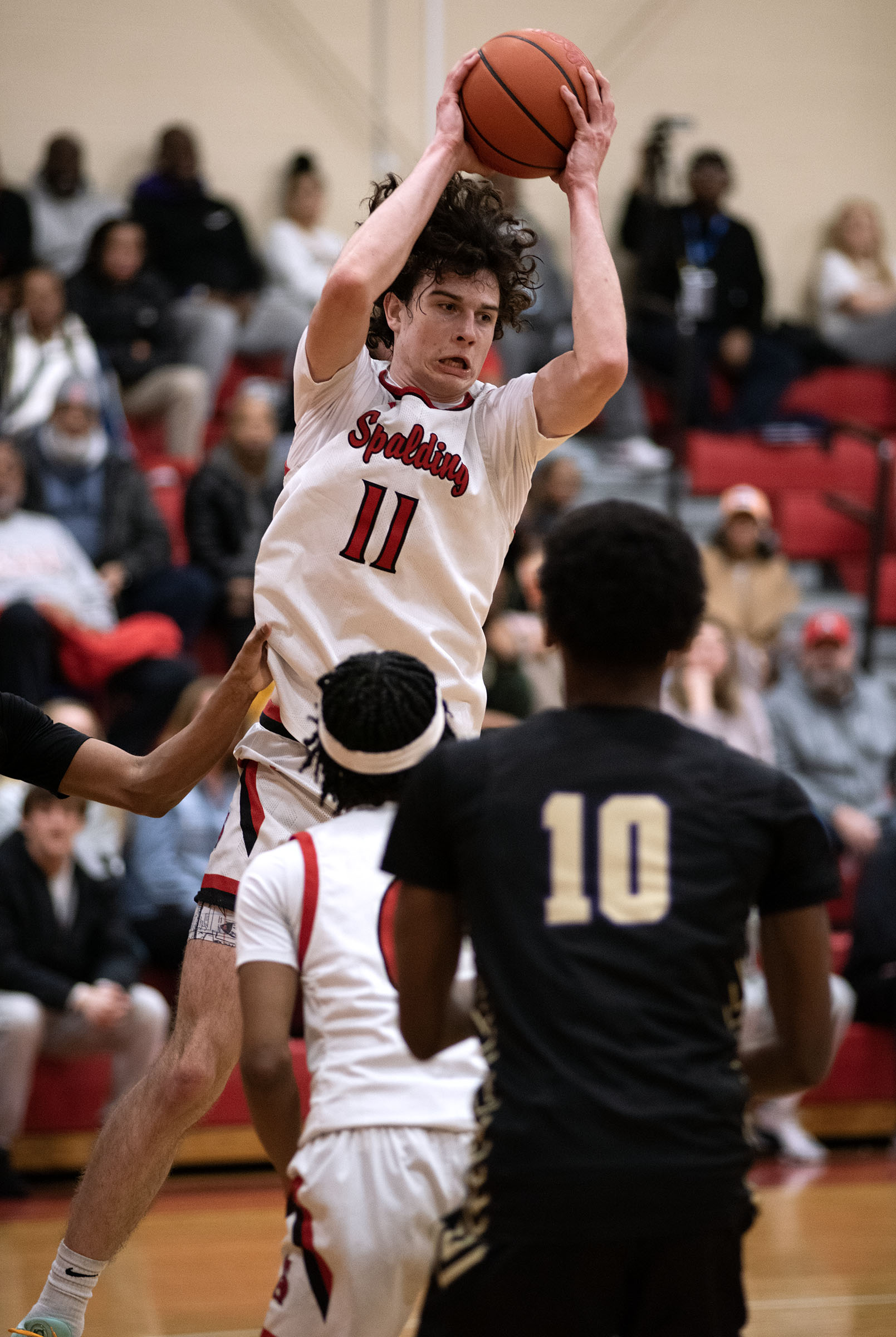 Jan. 3, 2025- Spalding’s Braxton Bogard grabs a rebound against...