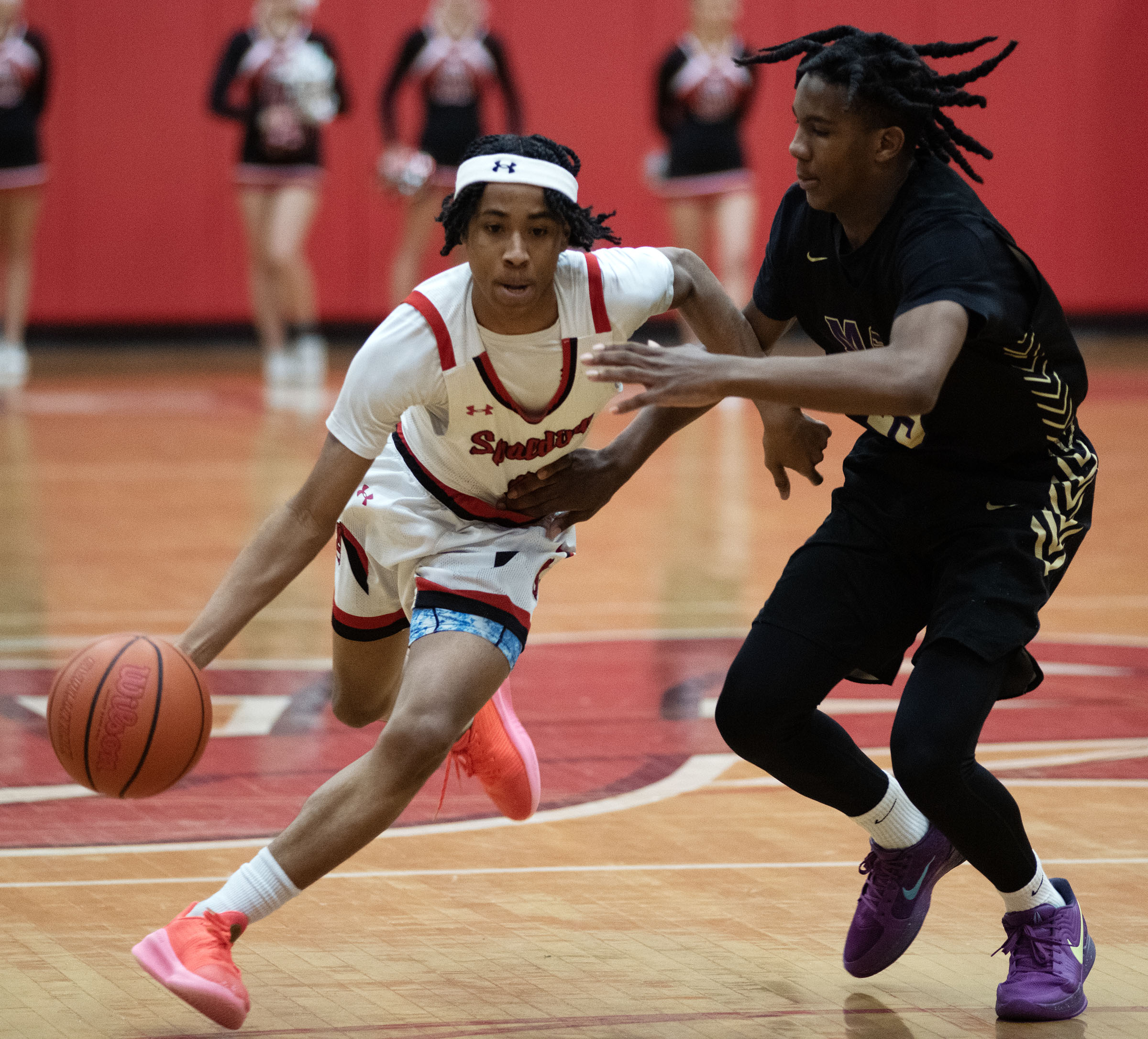 Jan. 3, 2025- Spalding’s Kam Carter dribbles against Mount Saint...