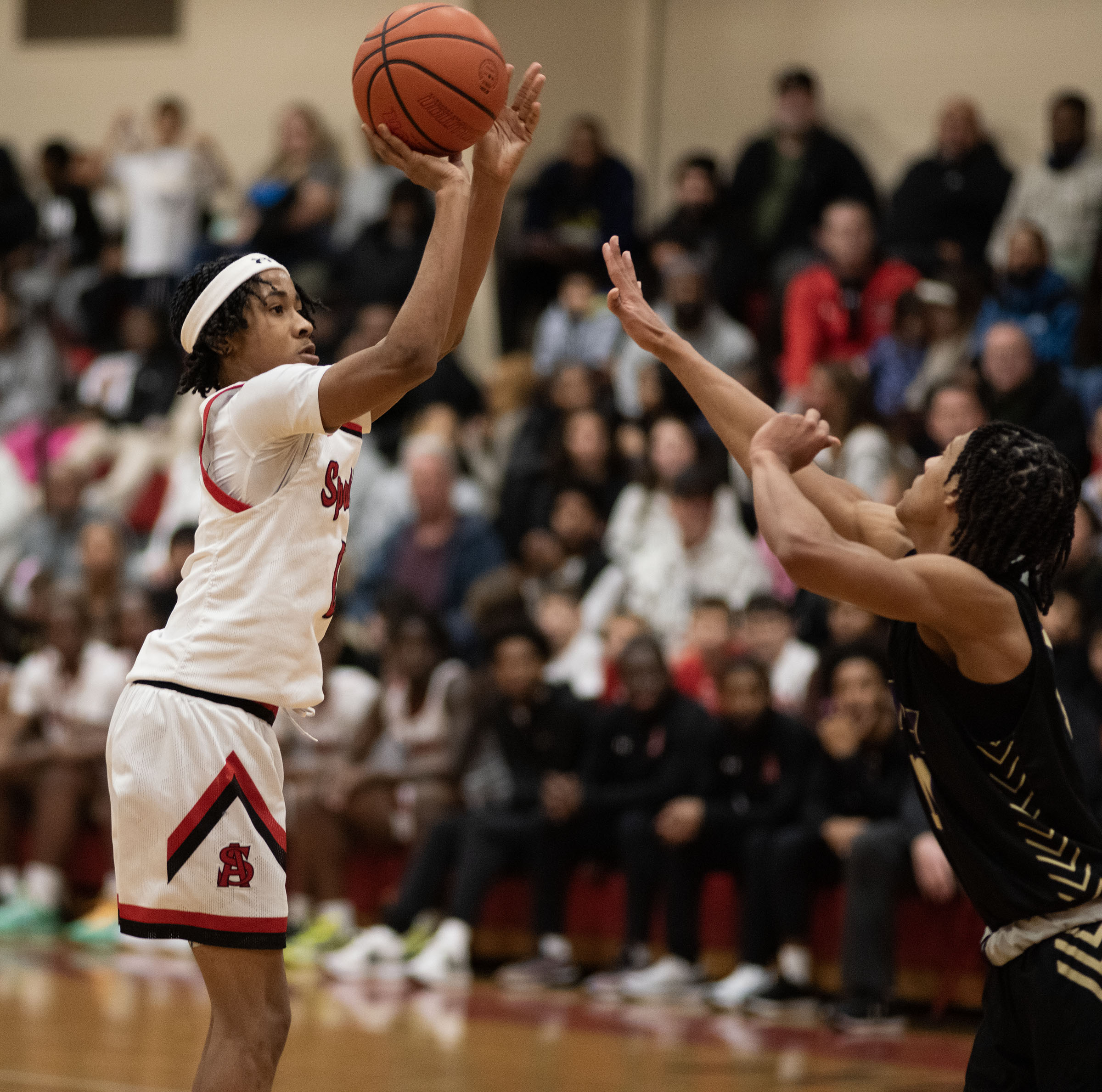 Jan. 3, 2025- Spalding’s Kam Carter shoots against Mount Saint...