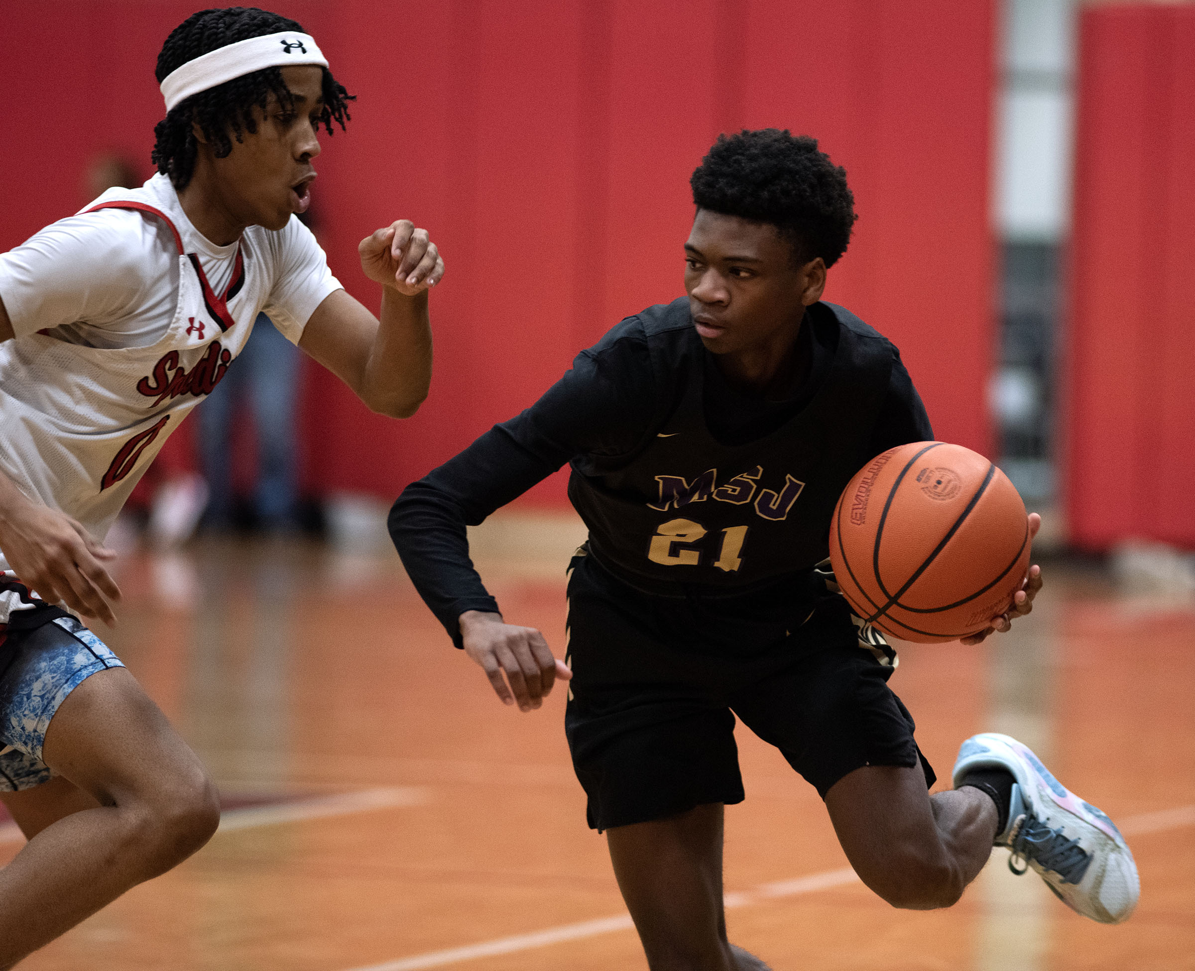 Jan. 3, 2025- Mount Saint Joseph’s Chauncey Word dribbles against...