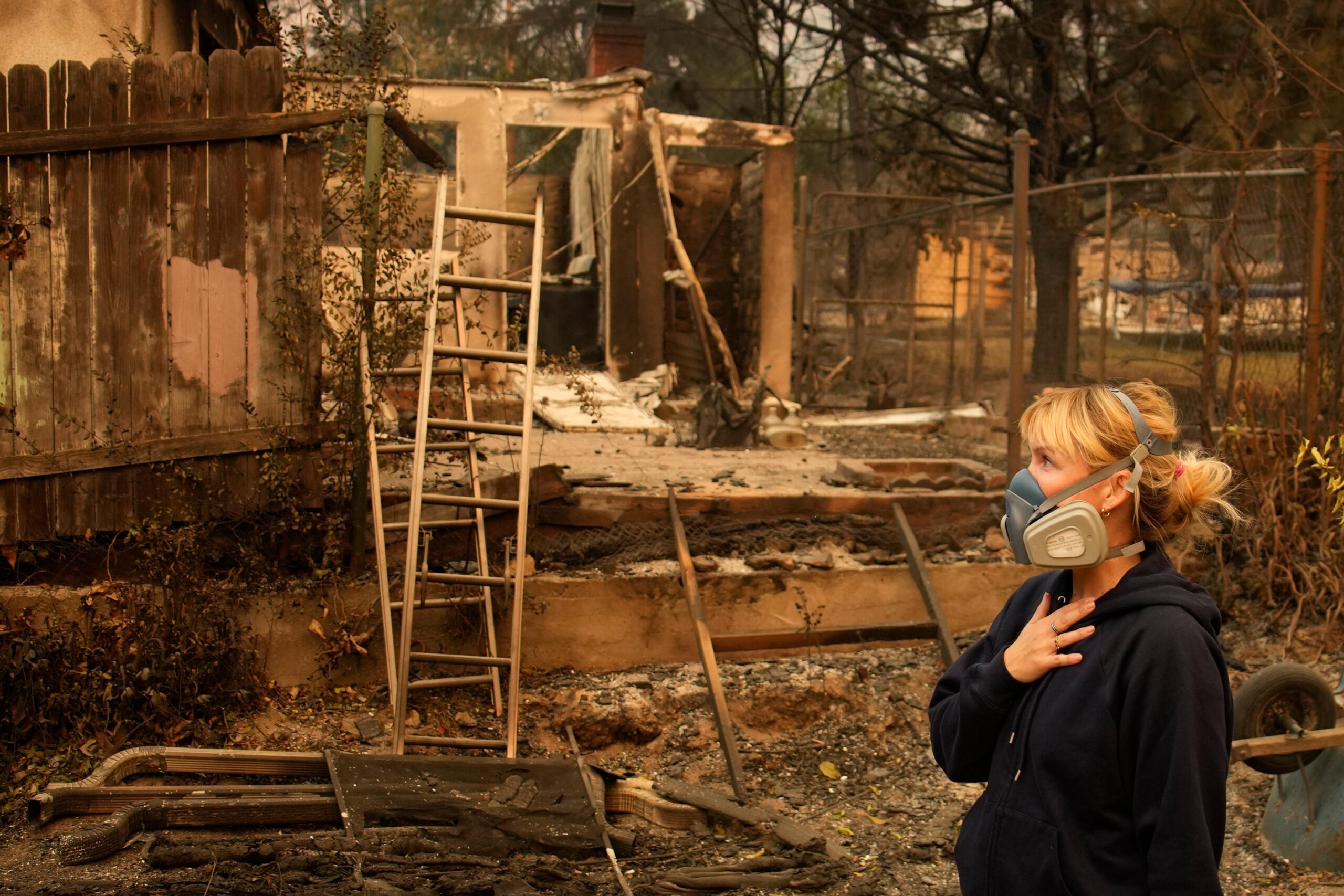 Lissa Renn looks at remains of her neighborhood In Altadena,...