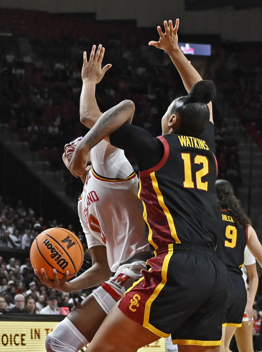 USC’s JuJu Watkins, right, fouls Maryland’s Shyanne Sellers, left, in...