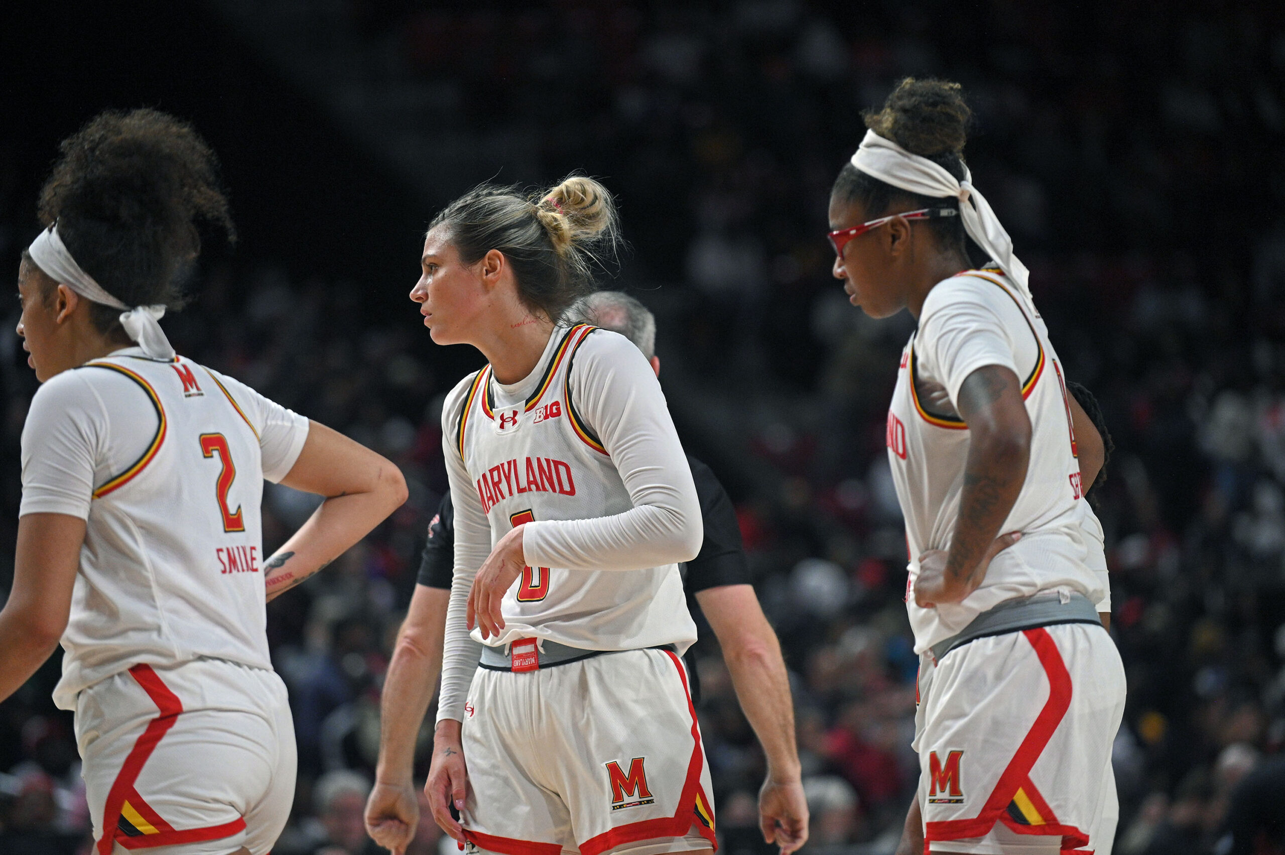 Maryland’s Saylor Poffenbarger, center, and Shyanne Sellers, right, show frustration...