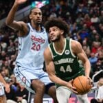 Dec 21, 2024; Milwaukee, Wisconsin, USA; Milwaukee Bucks forward Andre Jackson Jr. (44) drives against Washington Wizards center Alex Sarr (20) in the second quarter at Fiserv Forum.